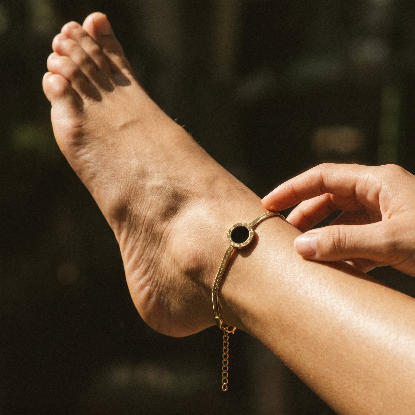 A Minimal Gold Anklet with a Timeless Roman Numeral Design